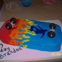 Skateboard Cake This cake was made for a boy that loves skateboarding. It is buttercream icing with fondant struts and wheels.