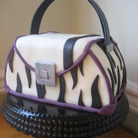 Zebra Print Purse Cake This bachelorette party purse cake is decorated with home made marshmallow fondant zebra print and deep plum trim. The handle is gum paste...