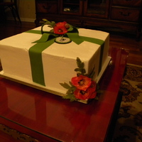 Cake For The Bride-To-Be! This was a 2 layer vanilla cake using a 14 inch square pan. It was iced in buttercream and accents were made of fandant. The flowers are...