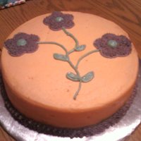 My 1St Cake simple flowers, drawn stems, used a cookie cutter for flower shape, outlined and filled in