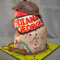 Indiiana Jones Cake Two tier topsy turvy cake in the Indiana Jones theme for a little boy named George.