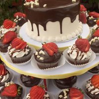 Chocolate Strawberry Cupcakes Chocolate cake with fresh strawberry filling. Iced in vanilla bean buttercream, topped with chocolate ganache, sliced strawberries, and...