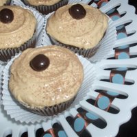 Mocha Cupcakes Chocolate cupcakes with cappuccino- cream cheese icing. Dusted with cocoa pwder and topped with a chocolate covered espresso bean. Yum!