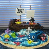 Pirate Ship This cake and and surroundings are made from fondant. Water was made from Butter Cream.