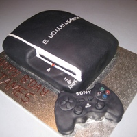 Playstation 3 Chocolate swirl sponge cake covered with fondant. Control made from krispie treats and covered with Fondant. This was a hit with the older...