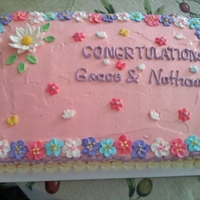 Its A Girl vanilla cake with whipped icing and royal & gum paste flowers