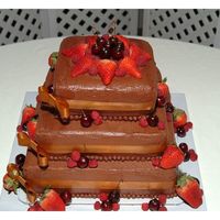 Chocolate Wedding Cake With Berries the bride wanted something different for a winter wedding, so we did chocolate on chocolate with strawberry jam filling and fresh cherries...