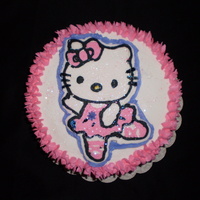 Hell Kitty Cake 2 layered french vanilla with buttercream icing and buttercream hello Kitty frozen transfer (1st attempt) With edible rainbow sparkles