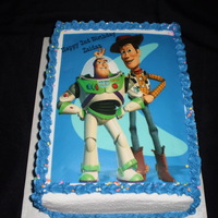 Toy Story Birthday Cake Toy Story edible image slab cake-1/2 chocolate cake & 1/2 white cake, covered in whipped buttercream icing and borders. Thanks for...