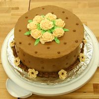 Twist On Final Wilton Class 1 Cake Mocha buttercream icing and ivory flowers, chocolate cake and cannoli filling. I made it to go into a teacher's breakfast the day...