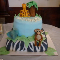 Zoo Crew Baby Shower Cake My first time making a baby shower cake for a friend. The animals and palm tree were made out of marzipan.