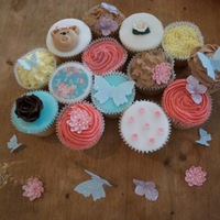 My First Cupcakes =D Vanilla cupcakes with a variety of toppings: buttercream (chocolate and vanilla), poured fondant (blue and white) and rolled sugarpaste (...