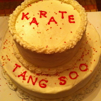 First Time Cake White sour cream almond cake with buttercream frosting. 10x3 bottom and 6x3 top. My first time stacking a well as icing.