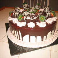 Chocolate Strawberry Cake 12in 2 layer chocolate cake, Strawberry mousse filled, buttercream and ganache . Dark chocolate dipped strawberries and strawberry mousse...