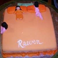 Slumber Party Vanilla Bean cake with WBC, covered with Fondant. Girls are also made from fondant. Bed skirt is dusted with orange petal dust, orange...