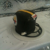 Steelers Football Helmet Red Velvet cake with cream cheese frosting. Grooms cake for a wedding. First time really carving anything like this. Struggles with the...
