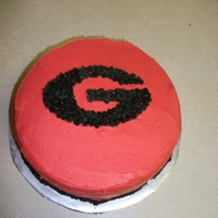 University Of Georgia Devil's Food cake, regular buttercream icing, black accents are done with chocolate buttercream. Banana flavored mousse.