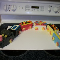 Train Very first attempt at...well, anything. Baked in loaf pans, then cut into the right shapes for the cars, and lots of cany to decorate.