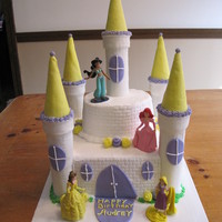 Castle Cake Bottom layer (2) 10x10 square. Top (2) 6 inch round. Turrets made from paper towel rolls and plain cone for the bottom, sugar for the top....