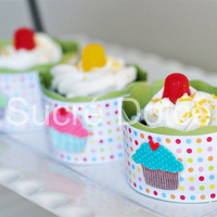 Dots Cupcakes Homemade wrappers done with martha stewart craft supplies. Cupcakes topped with Dots candies and sprinkles.