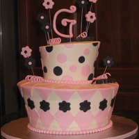 My First Topsy Turvy! My very first stacked cake and topsy turvy! Lemon cake; buttercream with fondant accents. 10" & 6" tiers. TFL!