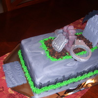 A Cop's Cake Vanilla/almond buttercream filled cake. Fondant figures and detailing.