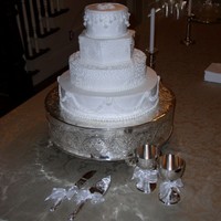 All White Wedding Cake 4-tier, round and octagonal shaped layers, all buttercream. My first wedding cake.