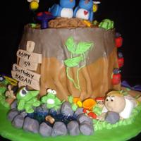 Tree Trunk butter cream icing covered in fondant. This was for a 4 year old boy who collects bugs.