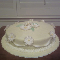 Mother's Day Ii My mom's 2nd Mother's day cake. Its marshmallow fondant with gum paste flowers and ribbons.