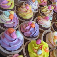 Mini Cupcake Cornets For My Daughter's Nursery Mini chocolate cupcakes placed into flat bottomed ice cream cones and sealed with buttercream, decorated with a multicoloured vanilla...