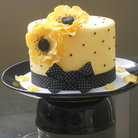 Flower Hat yellow fondant with black royal icing dots and 2 sugar anemone flowers
