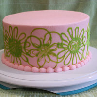Pink And Green Flowers A cake made to test the parchment paper chocolate transfer method I read in this years Wilton yearbook (2011?). I piped the flowers in...