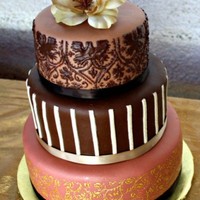 Anniversary Cake This cake was made for my aunt, who is an avid scrapbooker, so we found some scrapbook pages that reminded us of her style and made a cake...