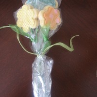 "fresh" Flowers I made these flower bouquets as favors for my daughter's first birthday. I used rolled fondant to decorate, green lollipop sticks for...
