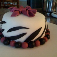 First Time Fondant Zebra Cake Two layered red velvet cake with butter cream frosting. Cake is covered in MMF. All accents are fondant. This was my first attempt in...