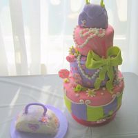 1St Birthday 1st birthday for my niece, also made the pirate ship for the same party (nephew's). MMF w/ some gumpaste on bow. Purse on top is RKT....