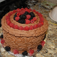 Chocolate Raspberry This is a cake I made for my moms friend. Chocolate cake with raspberry filling and chocolate buttercream frosting