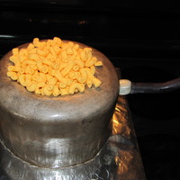 Mac N Cheese The pot is covered with fondant painted with edible glitter. Handle is gumpaste and pasta is fondant.