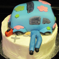 Hippie Mechanic Car is covered in fondant. Legs, tools, and toolbox are gumpaste.
