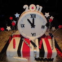 Happy New Year 2011 Marbelled white/dark choc mud cake with ganache. Fondant decorations. Ran out of time so didn't get to finish it 100%, but everybody...