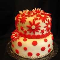 Red & White Cake This is a 2 tier cake I made for a couples 40th wedding anniversary. The flowers are made of fondant that I let dry over night in a flower...