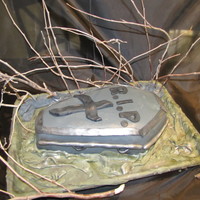 Coffin Cake This is my first halloween/coffin cake. I used 2 9x13 cakes and stacked them on top of each other then carved the coffin. This cake is...