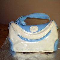 First Purse Cake I made this for my boyfriends mother for her birthday. Just used a round pan.and cut out a sort of moon shape piece from the cake to get a...