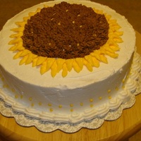Sunflower Cake Lemon Buttercream Cake is Lemon with Lemon buttercream. I took the crown that is cut off to level the cake and added it to the center of the sunflower to...