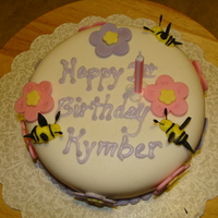 Kymbers First Birthday Cake Friend wanted her daughters 1st birthday cake with big flowers and bees because her daughter loves bees ! MMF with French Vanilla cake ....