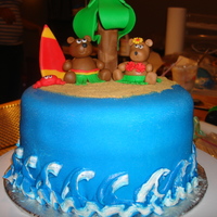 Hawaiin Wedding Shower Cake My first fondant cake! Decided to make a coconut cake with cream cheese buttercream, all figurines made out of fondant