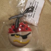 Pirate Cookies Done for my nephews 7th birthday to hand out in school. Got the idea from favorz.net. NFSC dipped in chocolate and decorated with RI