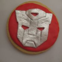 Transformer Cookie NFSC covered in MMF Transformer logo done in MMF I cut out each one individually then painted it in luster dust