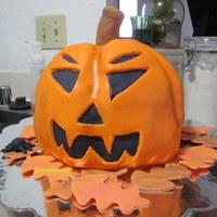 Jack O Lantern Pound cake with buttercream frosting covered in fondant. Happy Halloween!