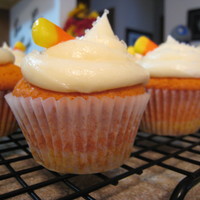 Candy Corn Cupcakes Vanilla cupcake dyed yellow and orange to look like a candy corn topped with buttercream frosting.
